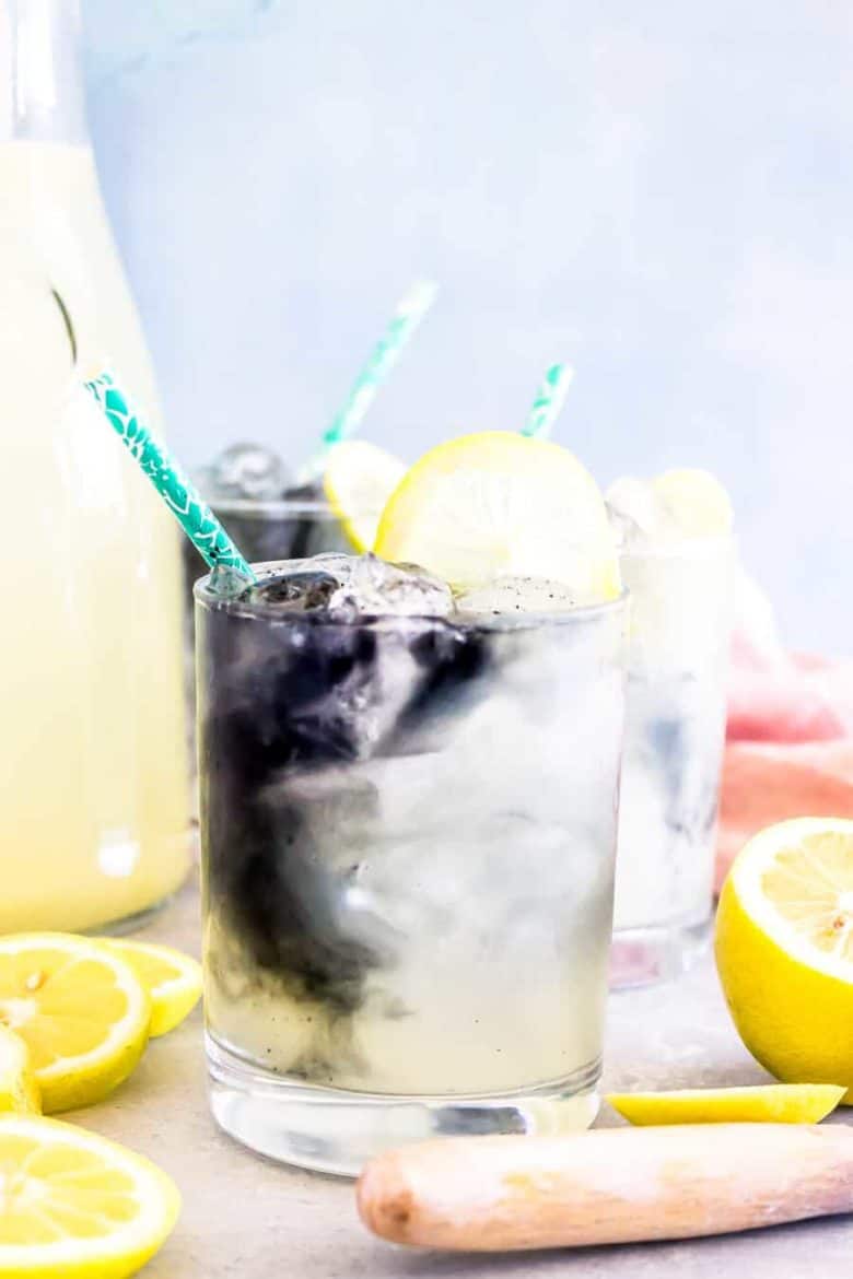 lemonade in a glass with cut lemons