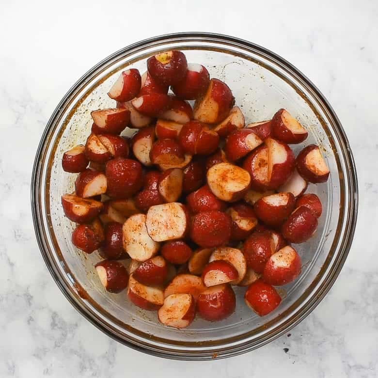 Radishes with spices in bowl