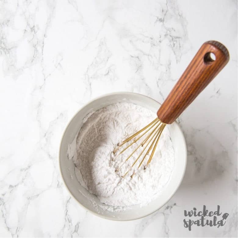 paleo baking powder recipe in bowl with whisk
