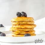 stack of paleo banana pancakes with blackberries