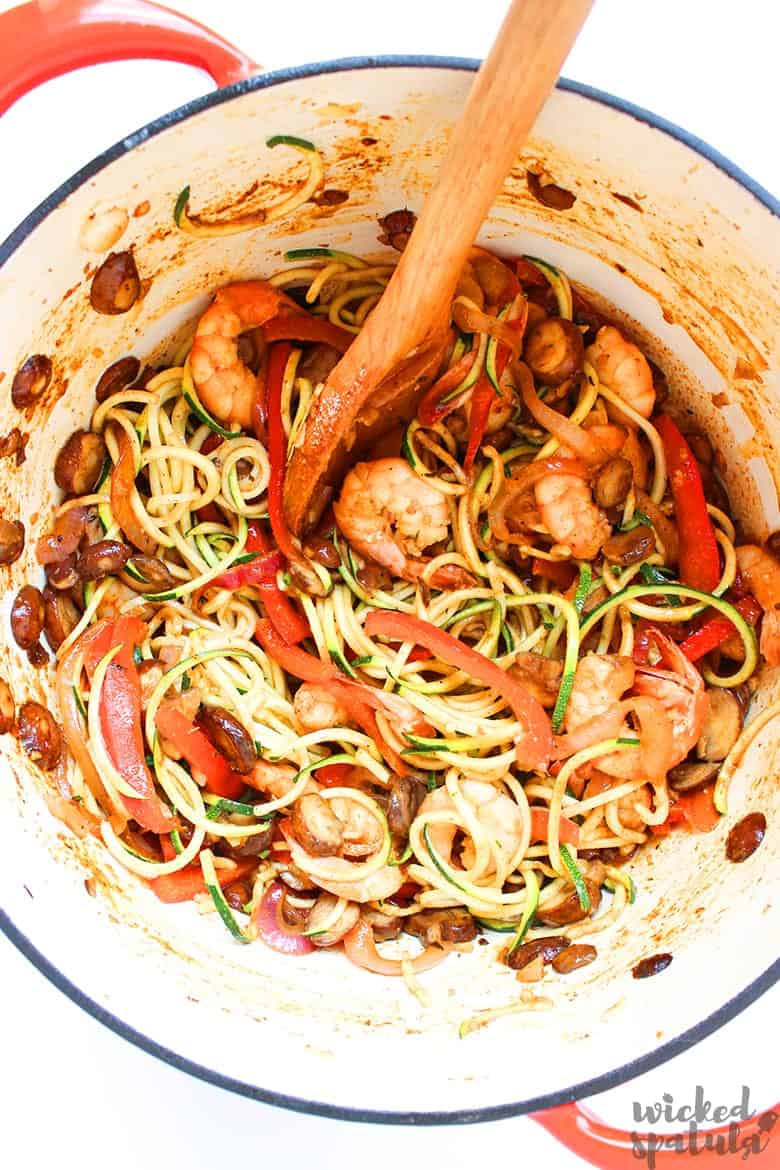 shrimp and zucchini noodles cooking in a pot