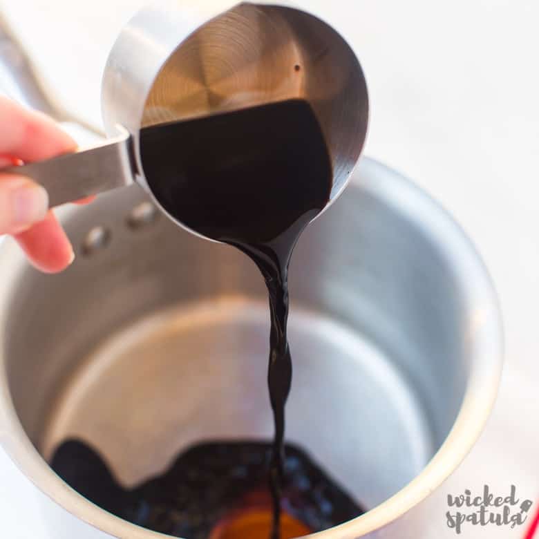 balsamic vinegar being poured into pan