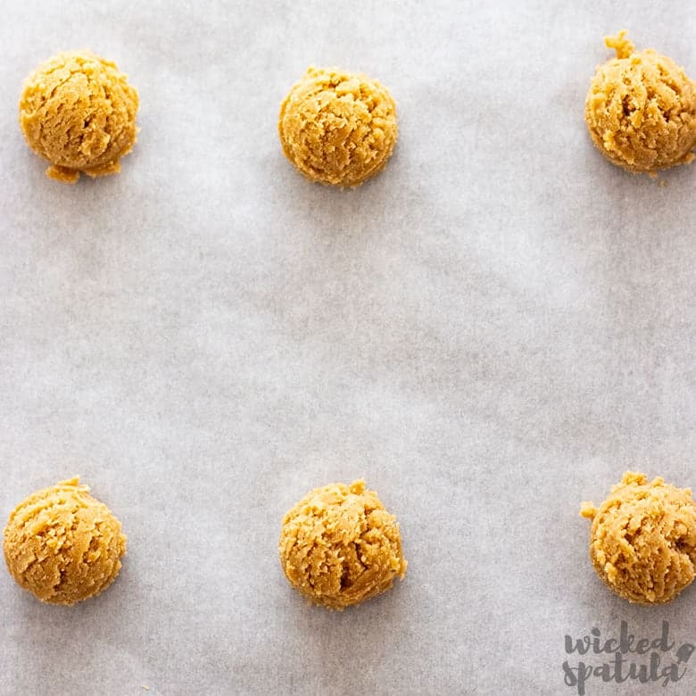 coconut flour sugar cookies in a ball on sheet pan