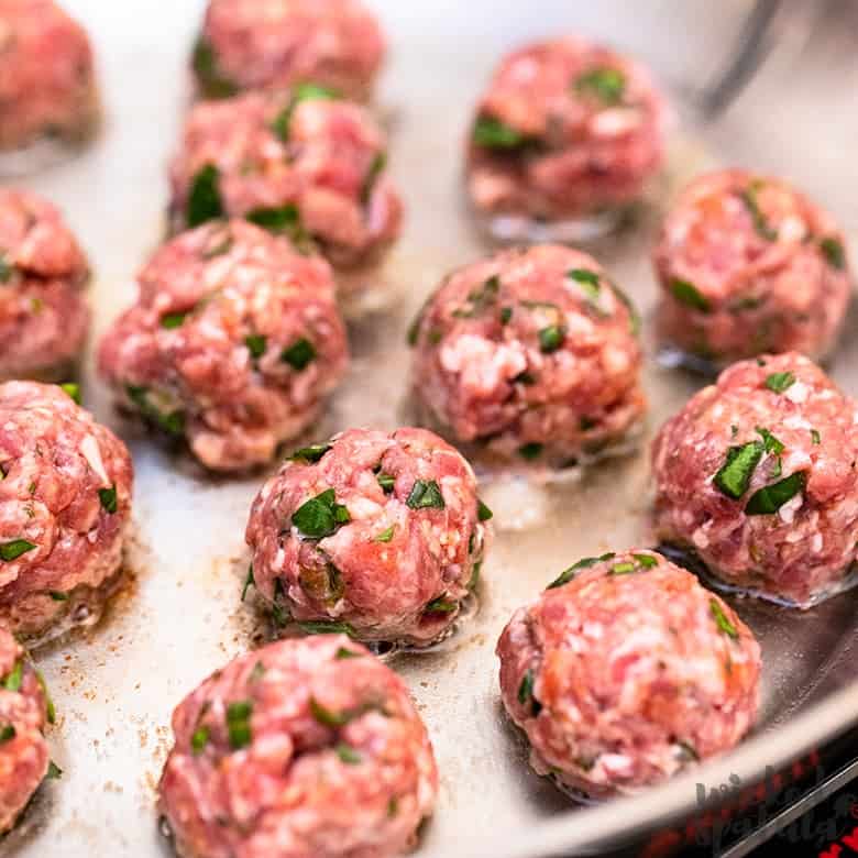 paleo meatballs browning in a pan