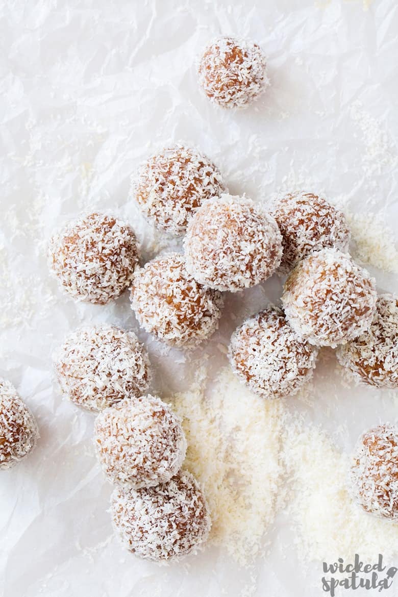 vegan paleo energy balls scattered on parchment paper