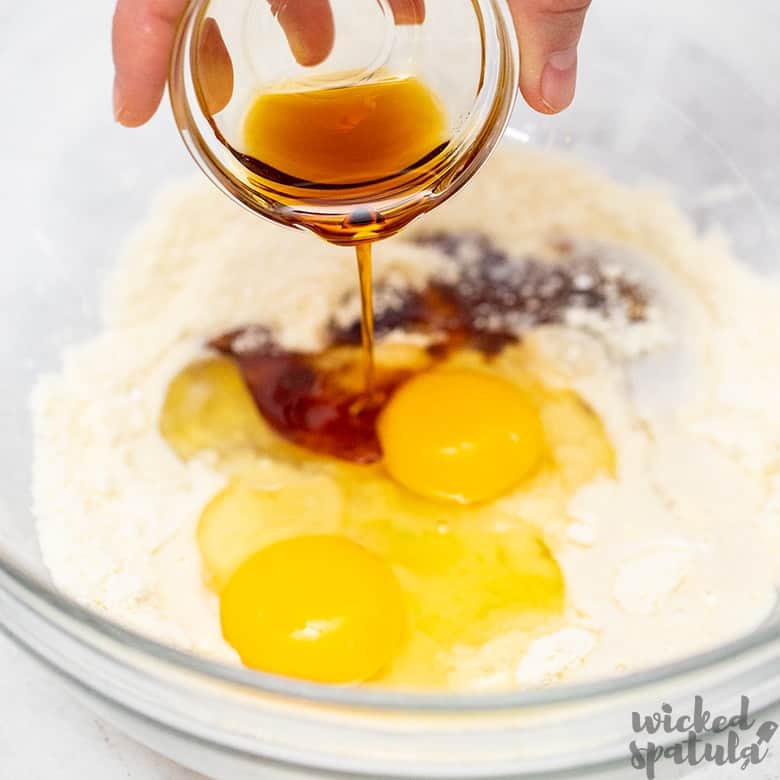 adding wet ingredients for paleo waffles with almond flour