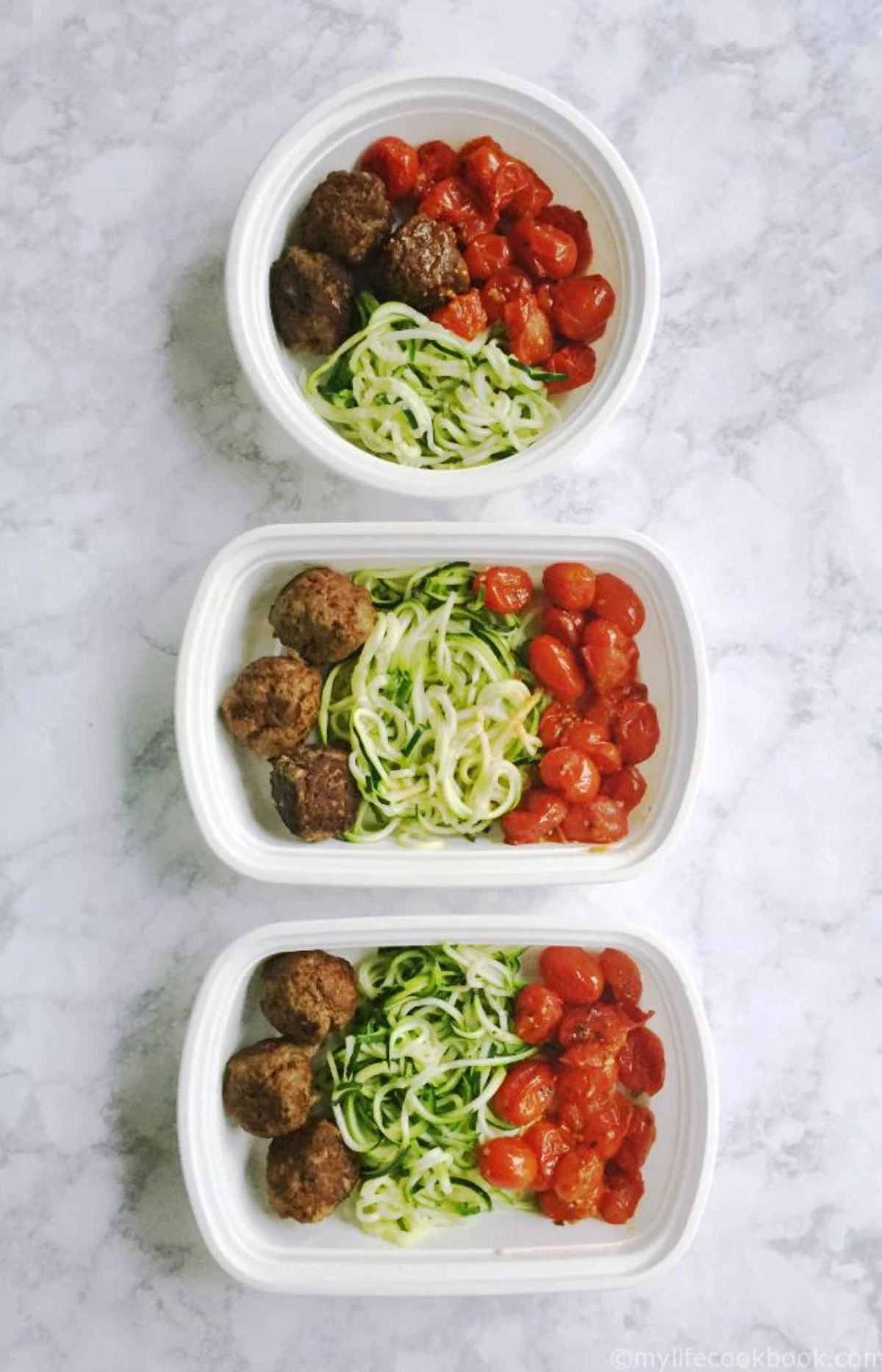 3 containers of meatballs, zoodles and baked plum tomatoes