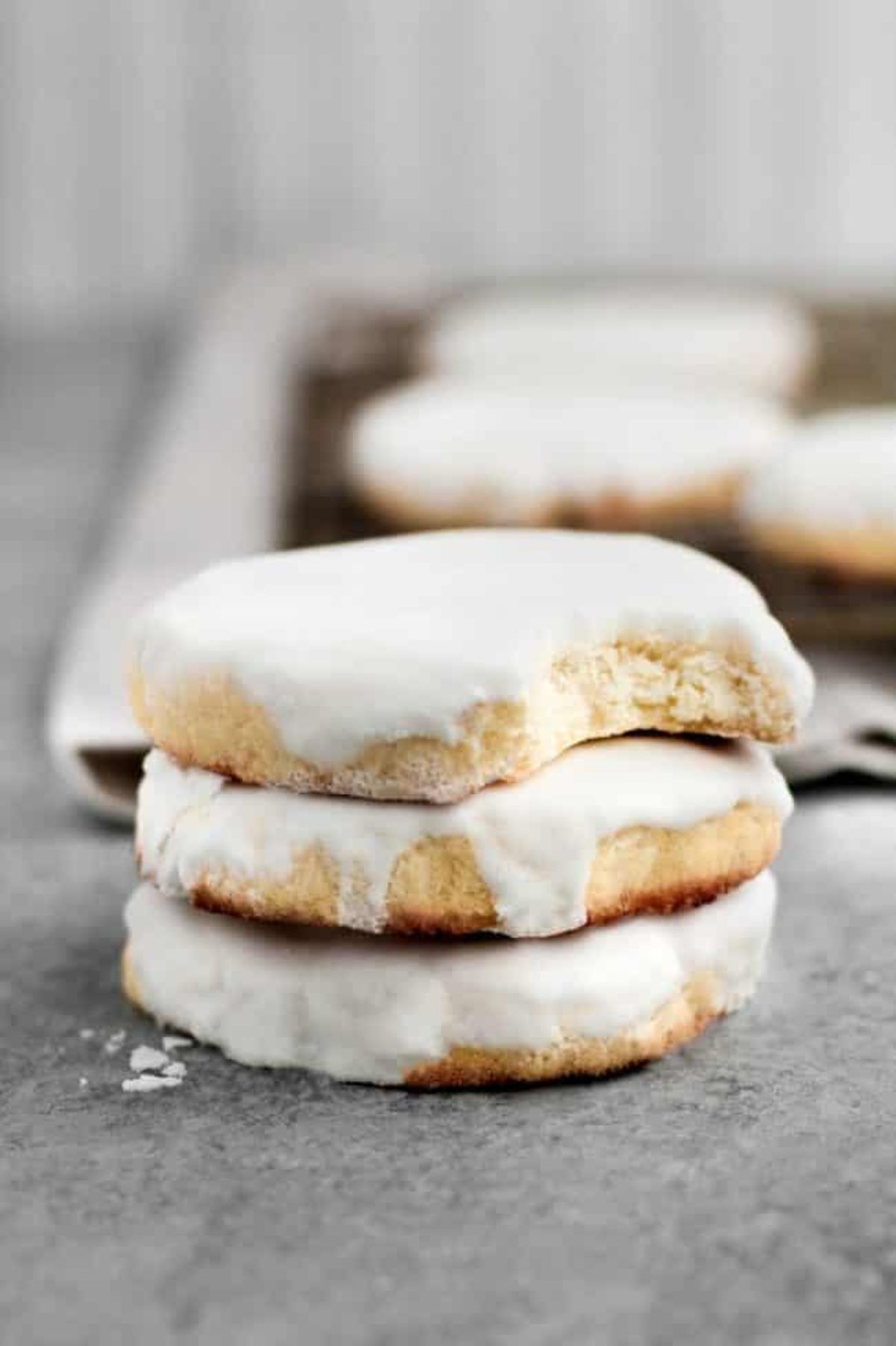 A pile of 3 iced sugar cookies