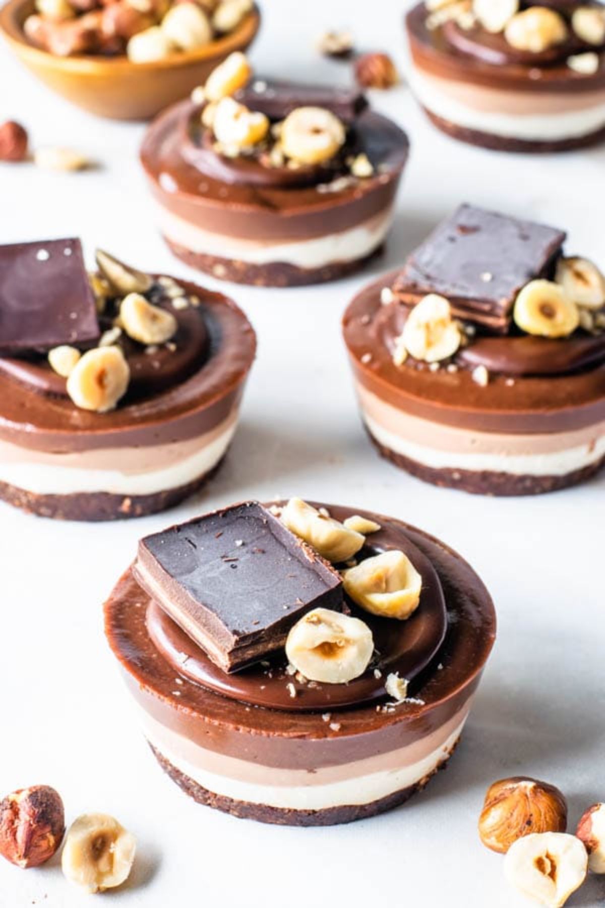 6 chocolate covered cheesecake cups, topped with hazlenuts and chocolate chunks