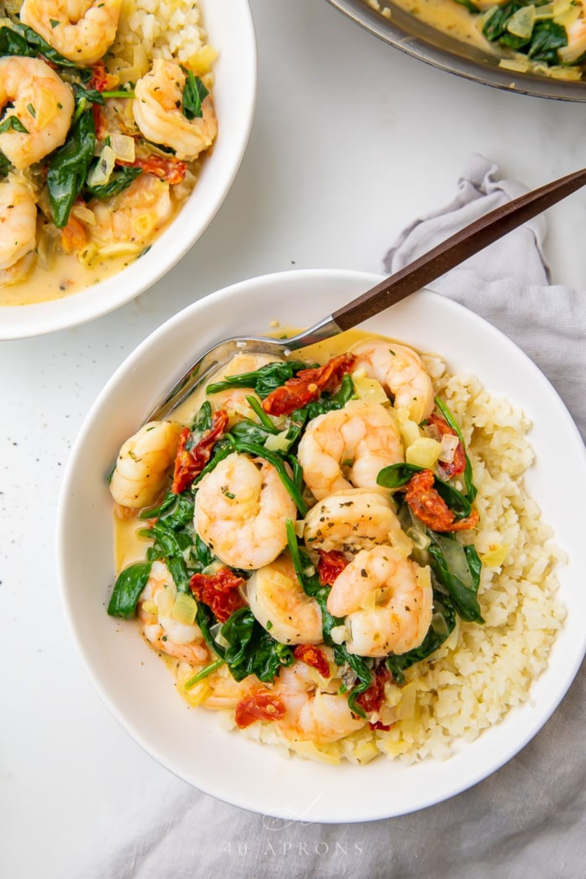 2 bowls of tuscan shrimp with cauliflower rice.