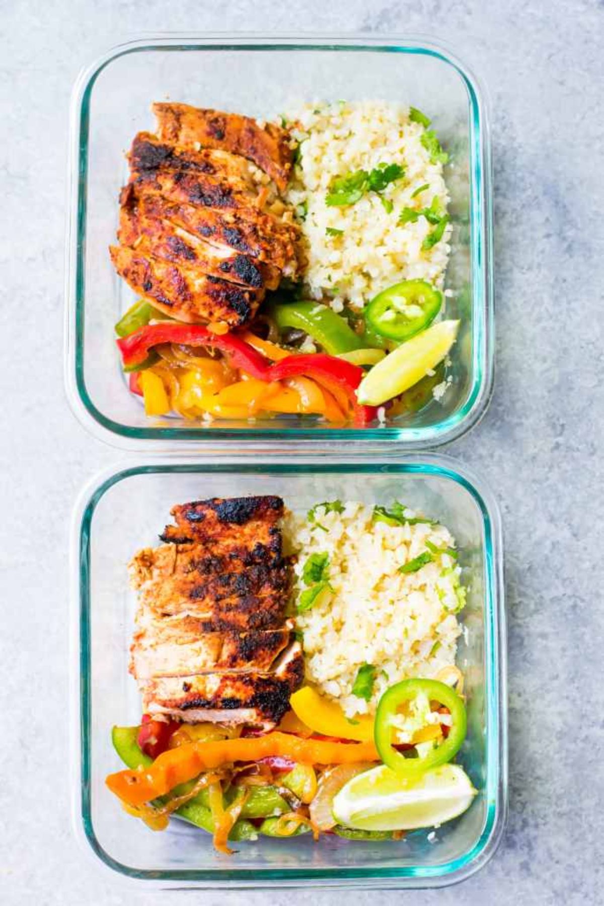 2 glass containers with chicken, cauliflower rice, and stir fried vegetables