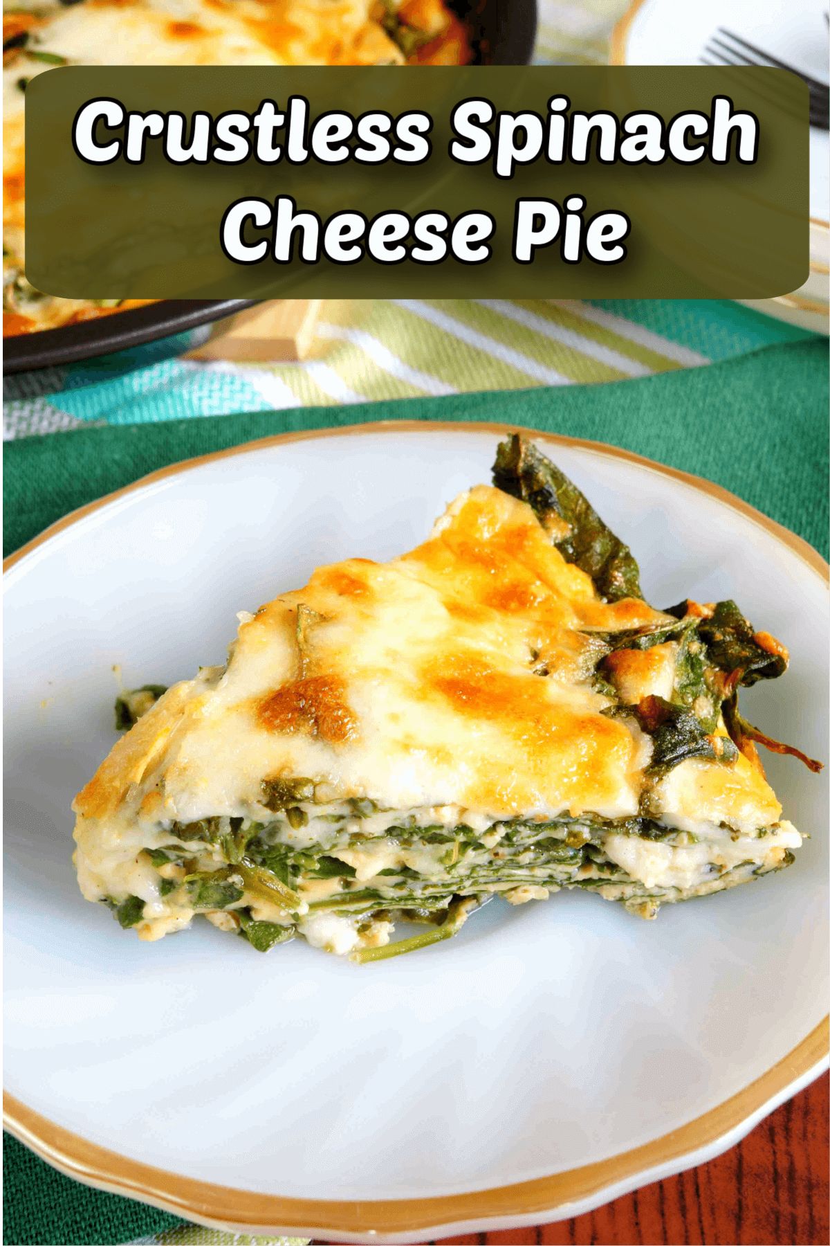 The text reads "Crustless Spinach Cheese Pie" The photo is of a white plate with a gold rim, on it is a slice of quiche. In the background is a partial shot of teh pan containing the rest of the quiche