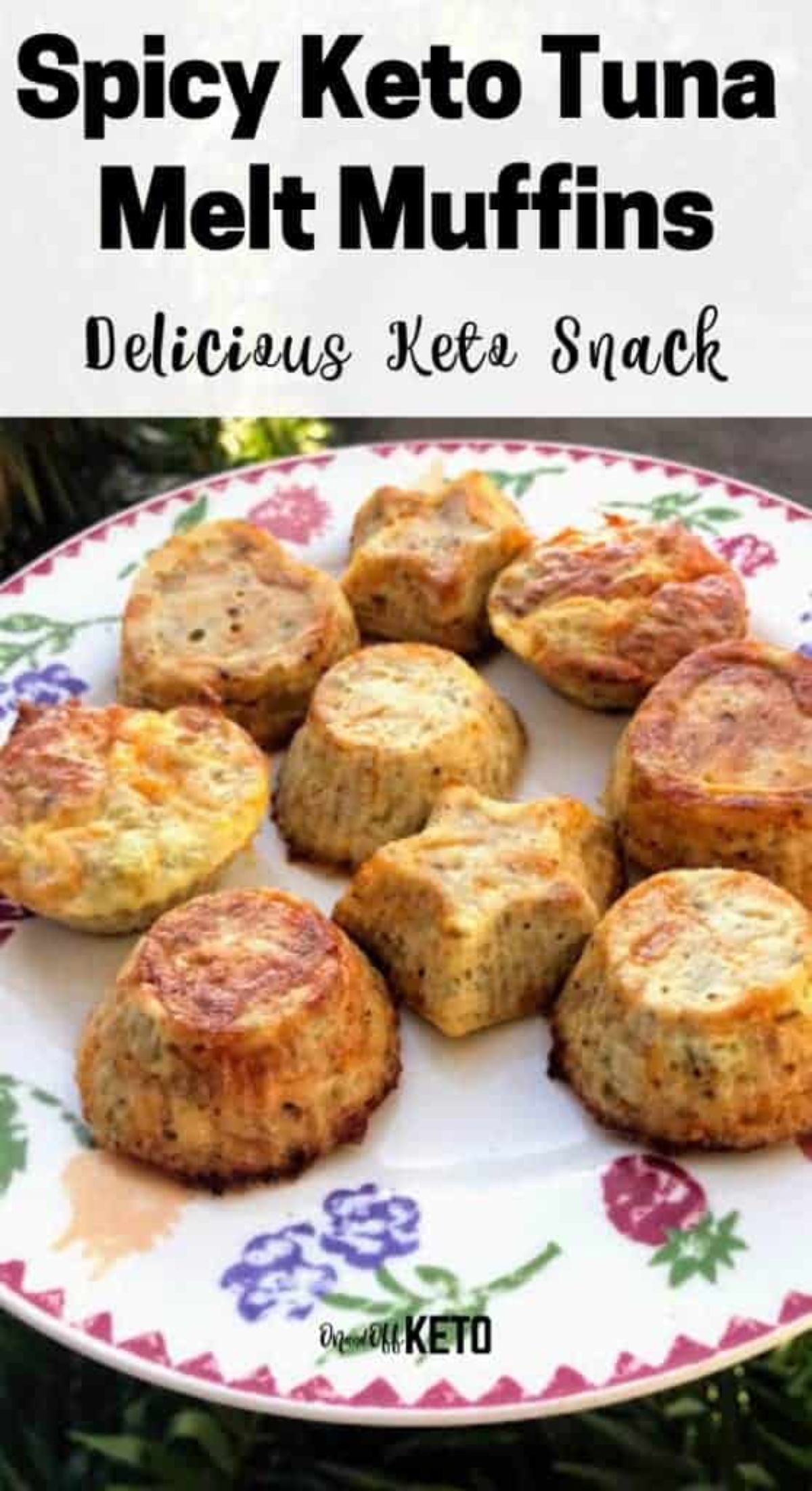 The text reads "Spicy Keto Tuna Melt Muffins. Delicious Keto Snack" The photo is of a round white plate with flower patterns around the rim. On it are different shaped small tuna melt muffins